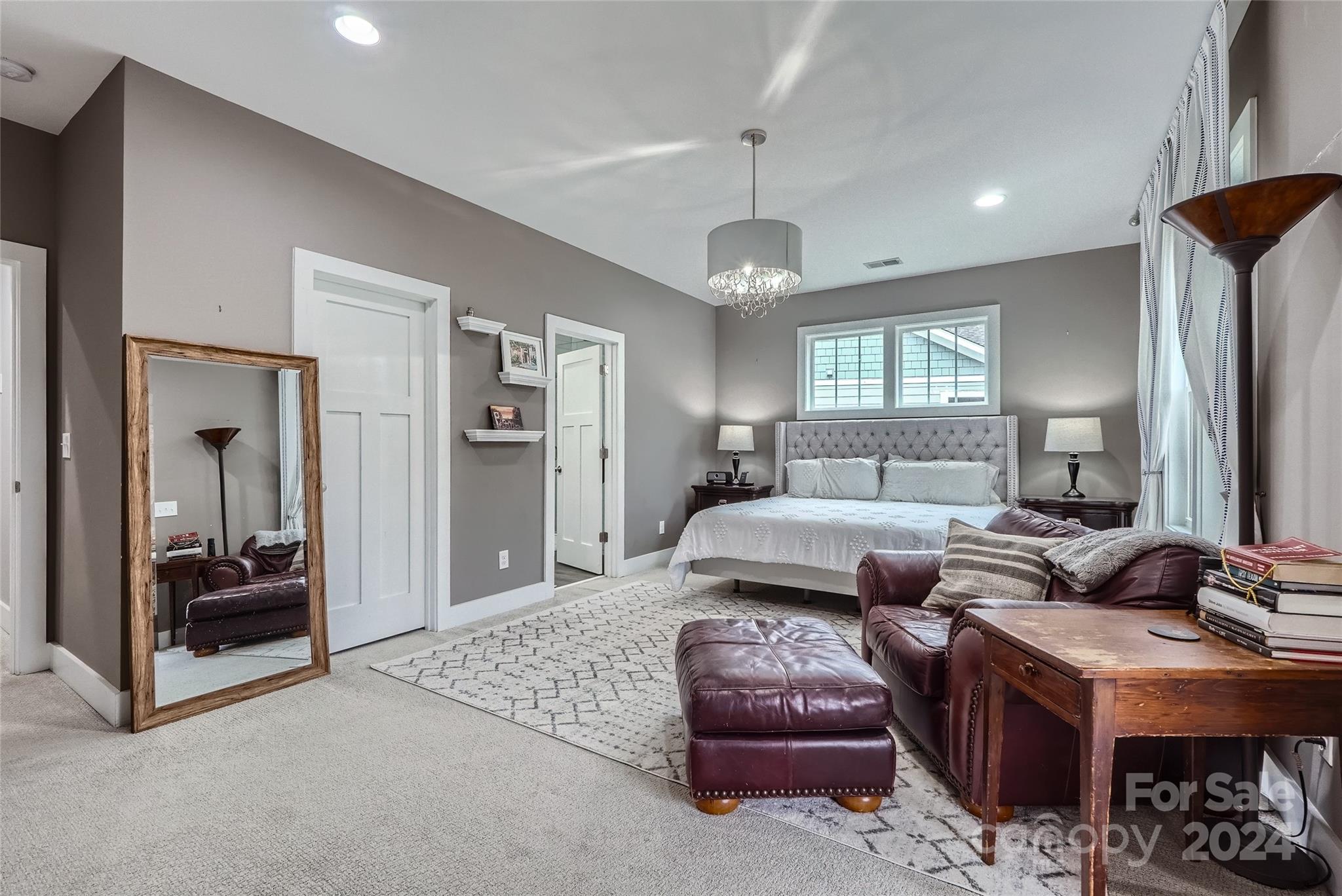 5220 Valley Stream Road Charlotte, NC 28209 - Photo 13 of 24 a living room with furniture and a chandelier