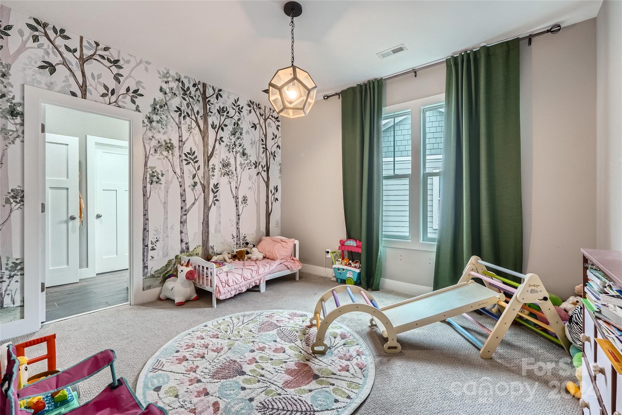 5220 Valley Stream Road Charlotte, NC 28209 - Photo 18 of 24 a bedroom with furniture and a window