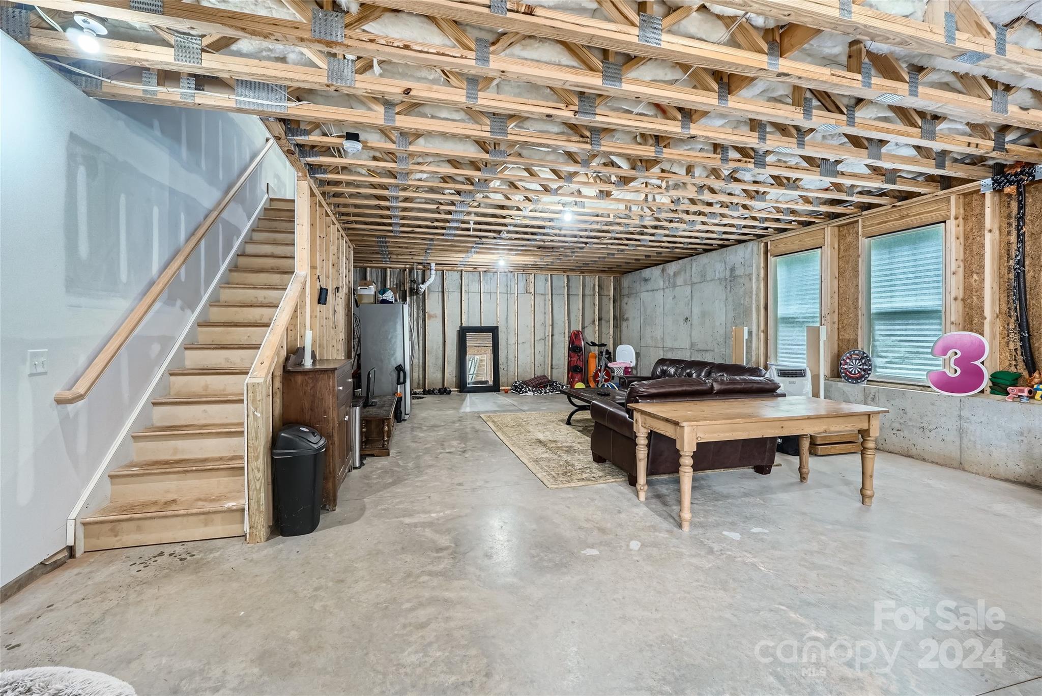5220 Valley Stream Road Charlotte, NC 28209 - Photo 21 of 24 a view of a room with stairs and furniture