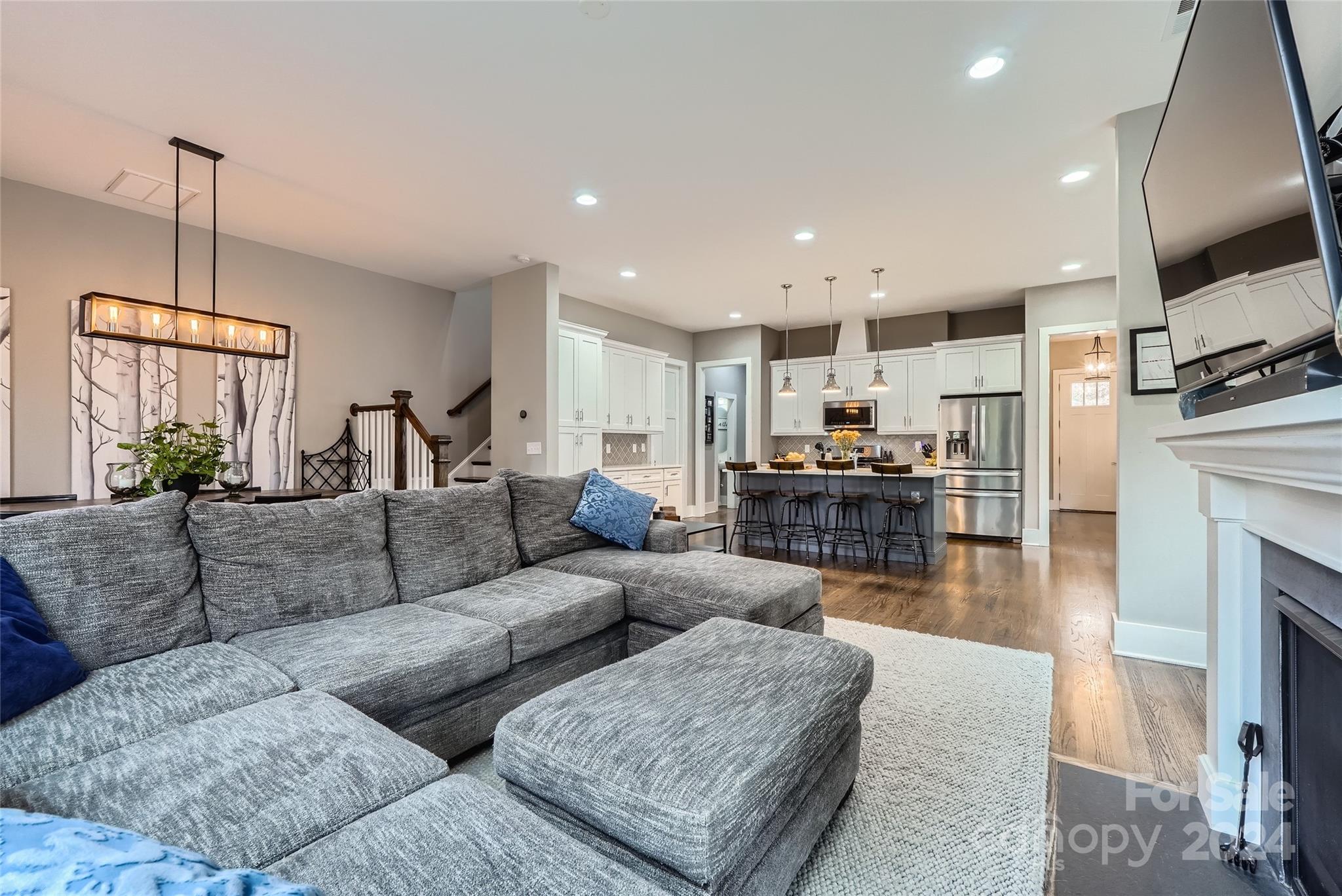 5220 Valley Stream Road Charlotte, NC 28209 - Photo 5 of 24 a living room with fireplace furniture and a flat screen tv