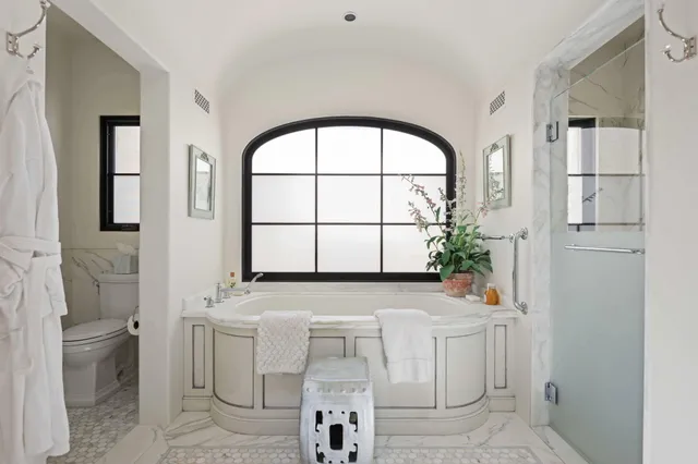 a bathroom with a sink a mirror and a toilet