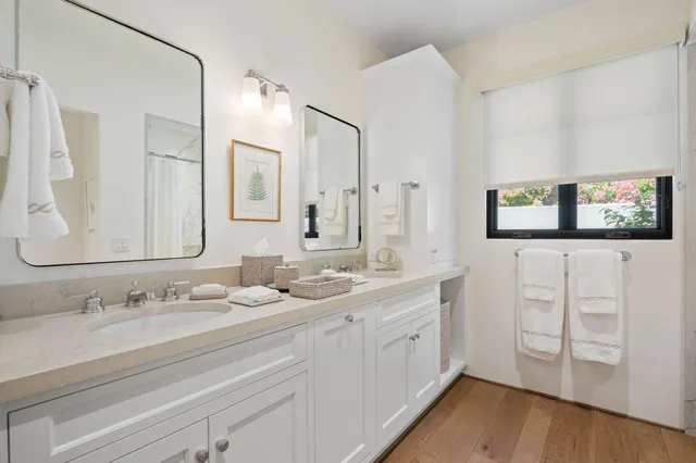 a view of an outdoor dining space with a table and chairs