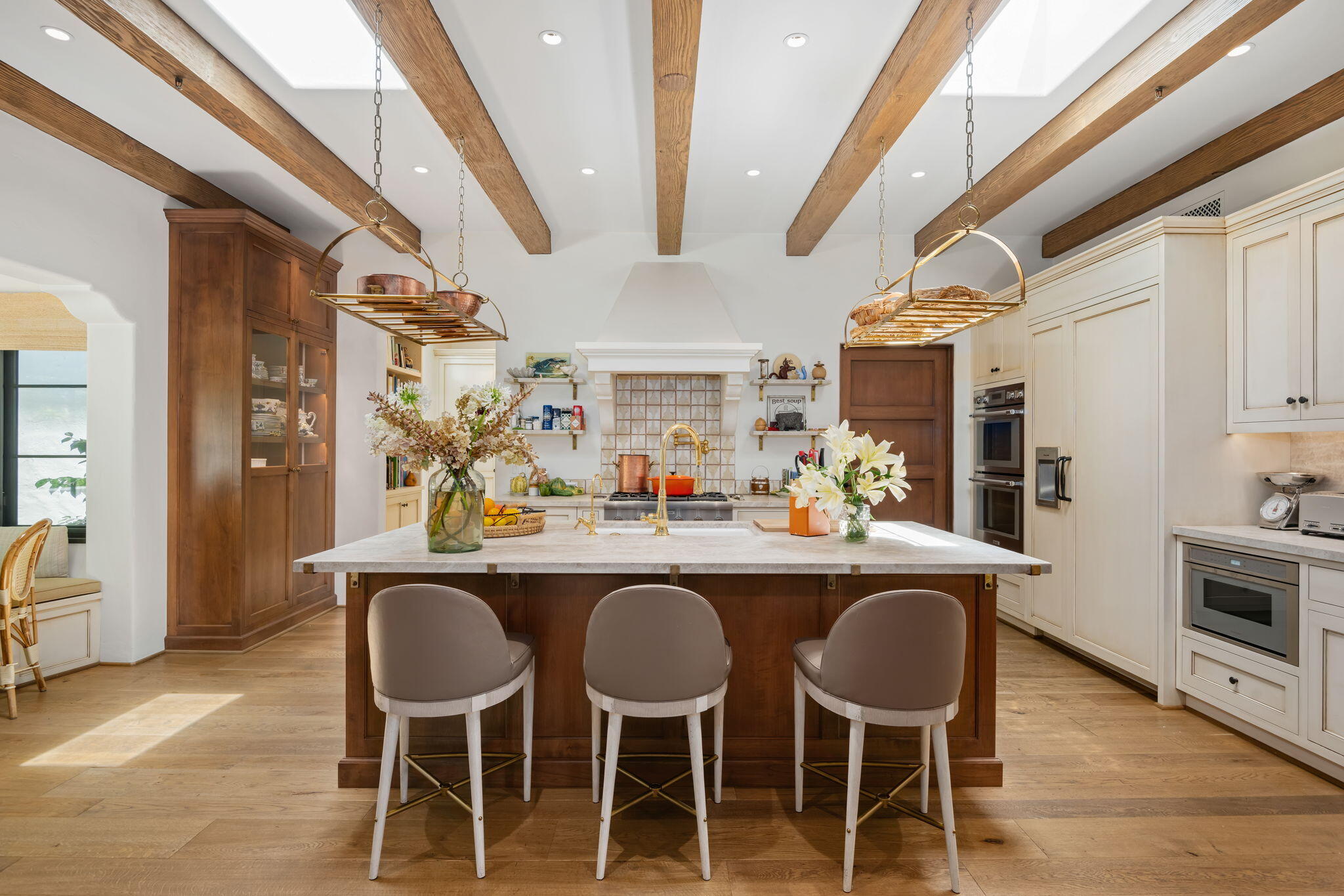 0 Boundary Drive Montecito, CA 93108 - Photo 7 of 26 a dining hall with stainless steel appliances kitchen island granite countertop a table chairs and wooden floor