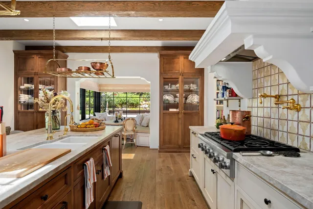 a kitchen with stainless steel appliances granite countertop a stove and a sink