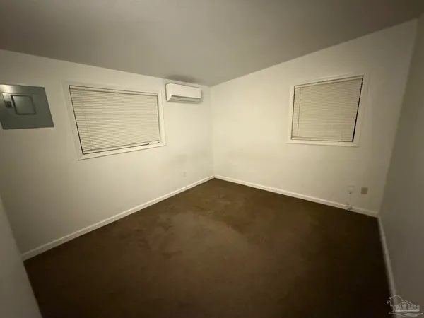 a view of a small space with wooden floor