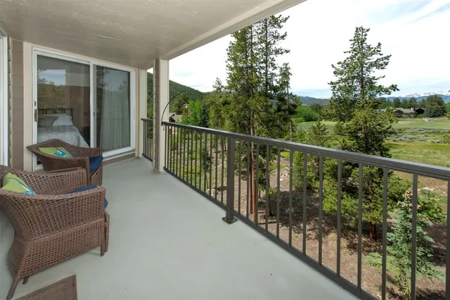 a view of a balcony with furniture