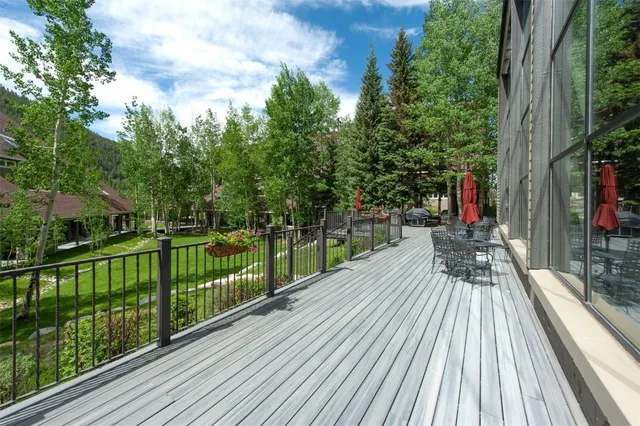 a view of a chairs and table on the balcony