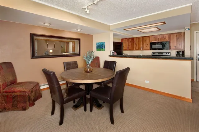a dining room with furniture and window