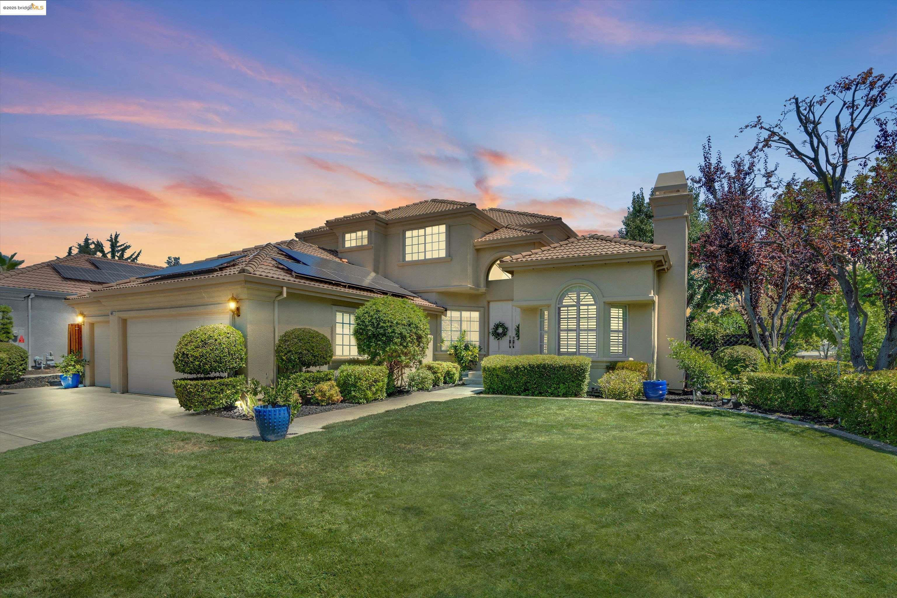 a front view of a house with a yard