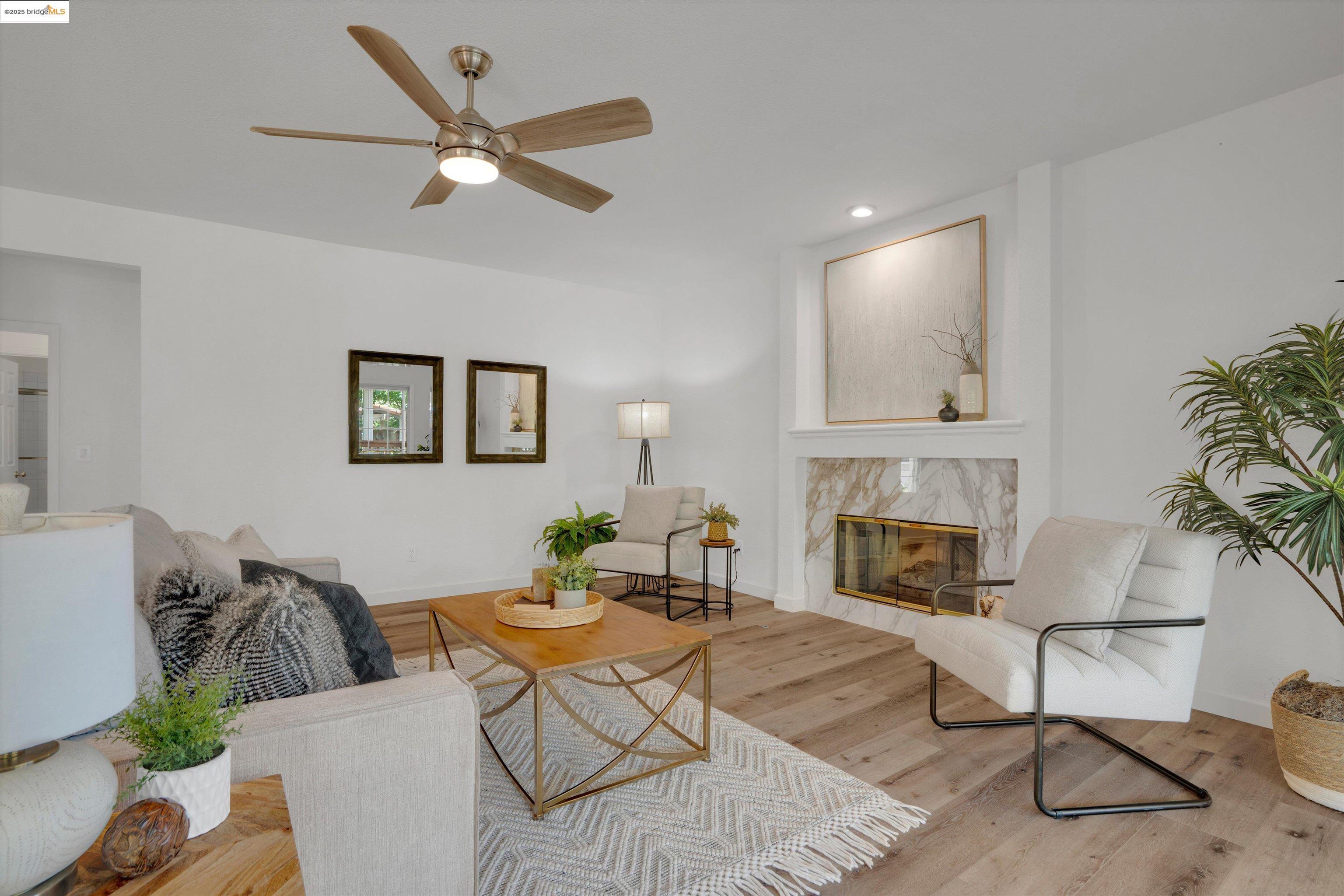 805 Devonshire Loop Brentwood, CA 94513 - Photo 12 of 51 a living room with furniture and a fireplace
