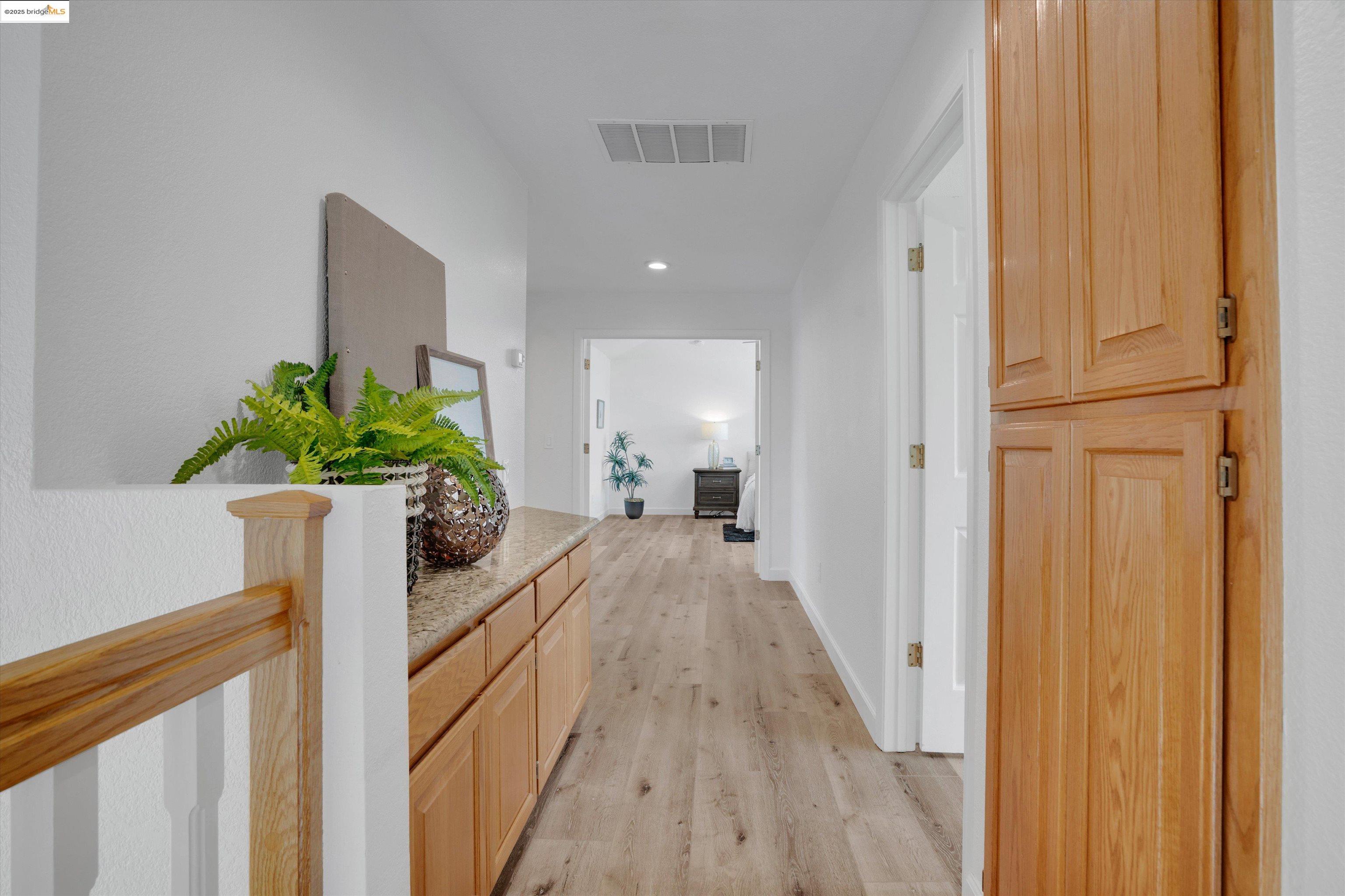 805 Devonshire Loop Brentwood, CA 94513 - Photo 21 of 51 a view of a hallway and a potted plant