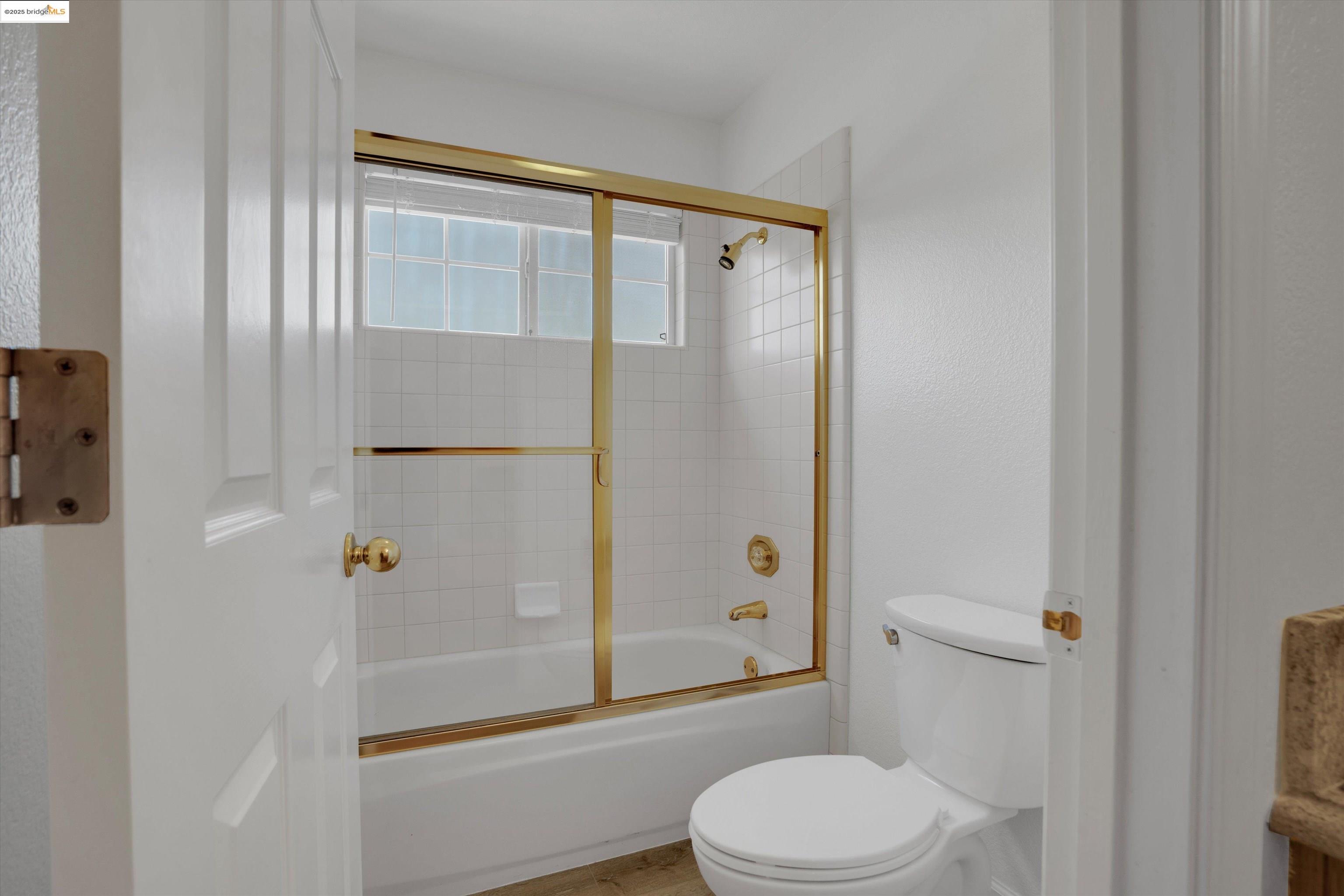 805 Devonshire Loop Brentwood, CA 94513 - Photo 24 of 51 a bathroom with a shower a toilet and a sink