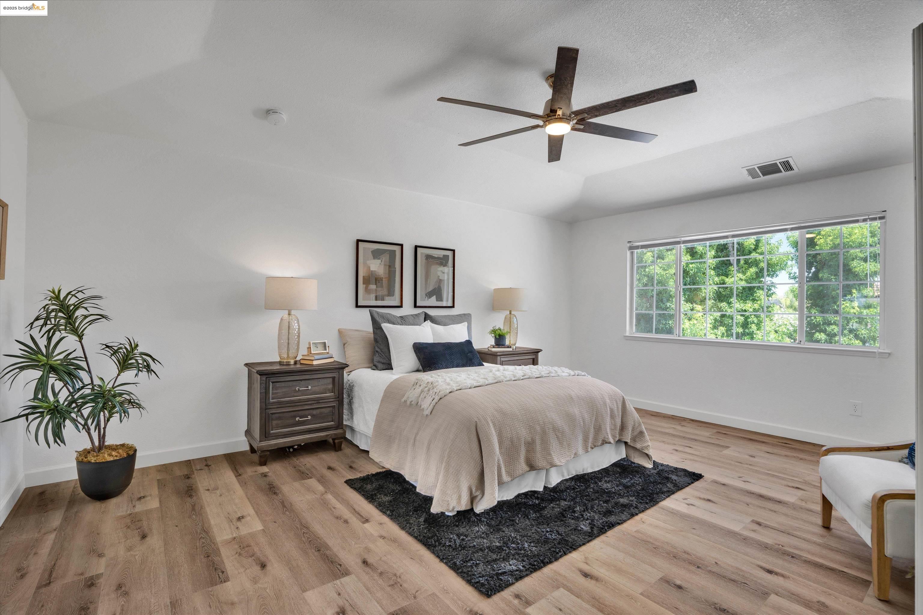 805 Devonshire Loop Brentwood, CA 94513 - Photo 25 of 51 a bedroom with bed and a potted plant