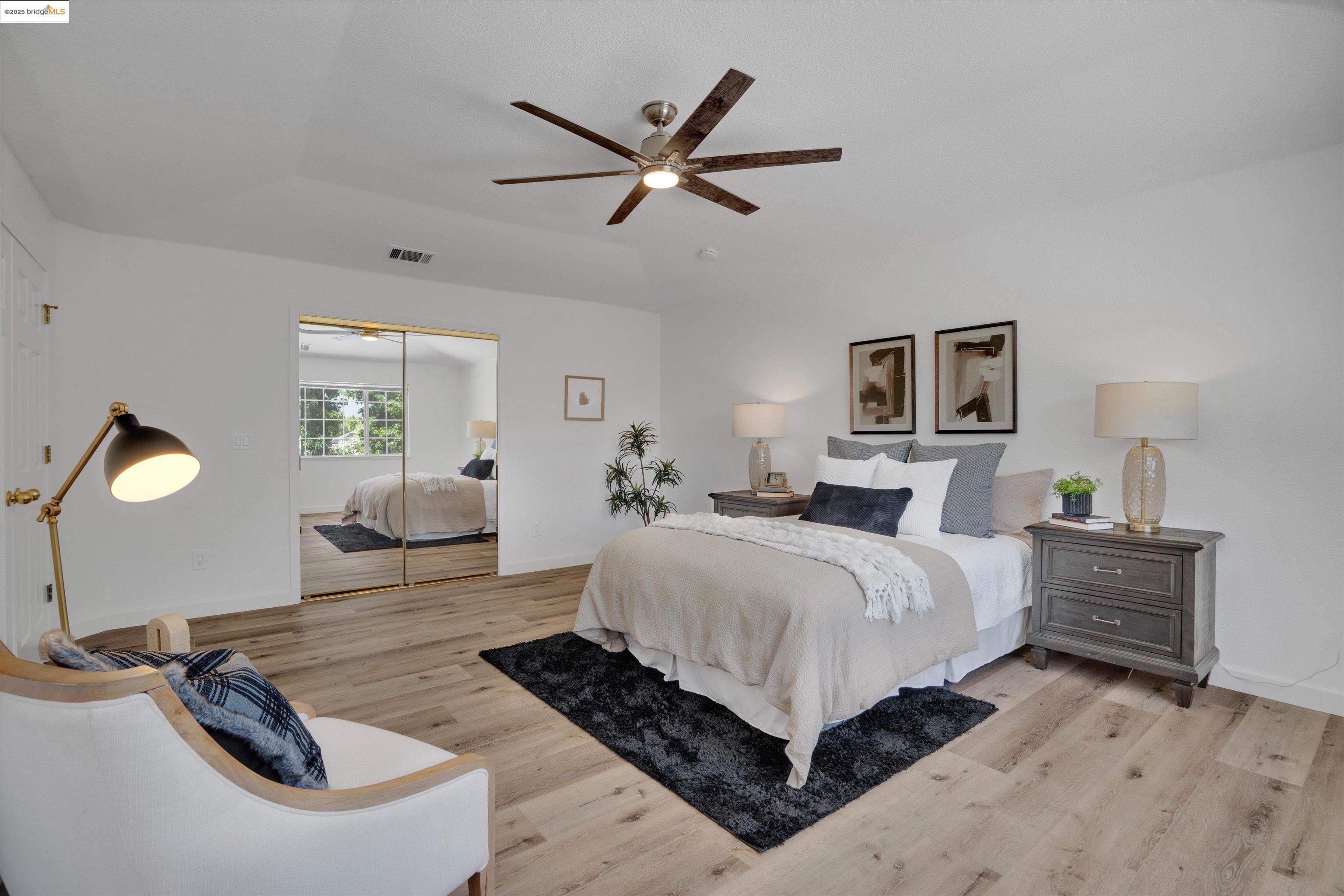 805 Devonshire Loop Brentwood, CA 94513 - Photo 26 of 51 a spacious bedroom with a bed and window