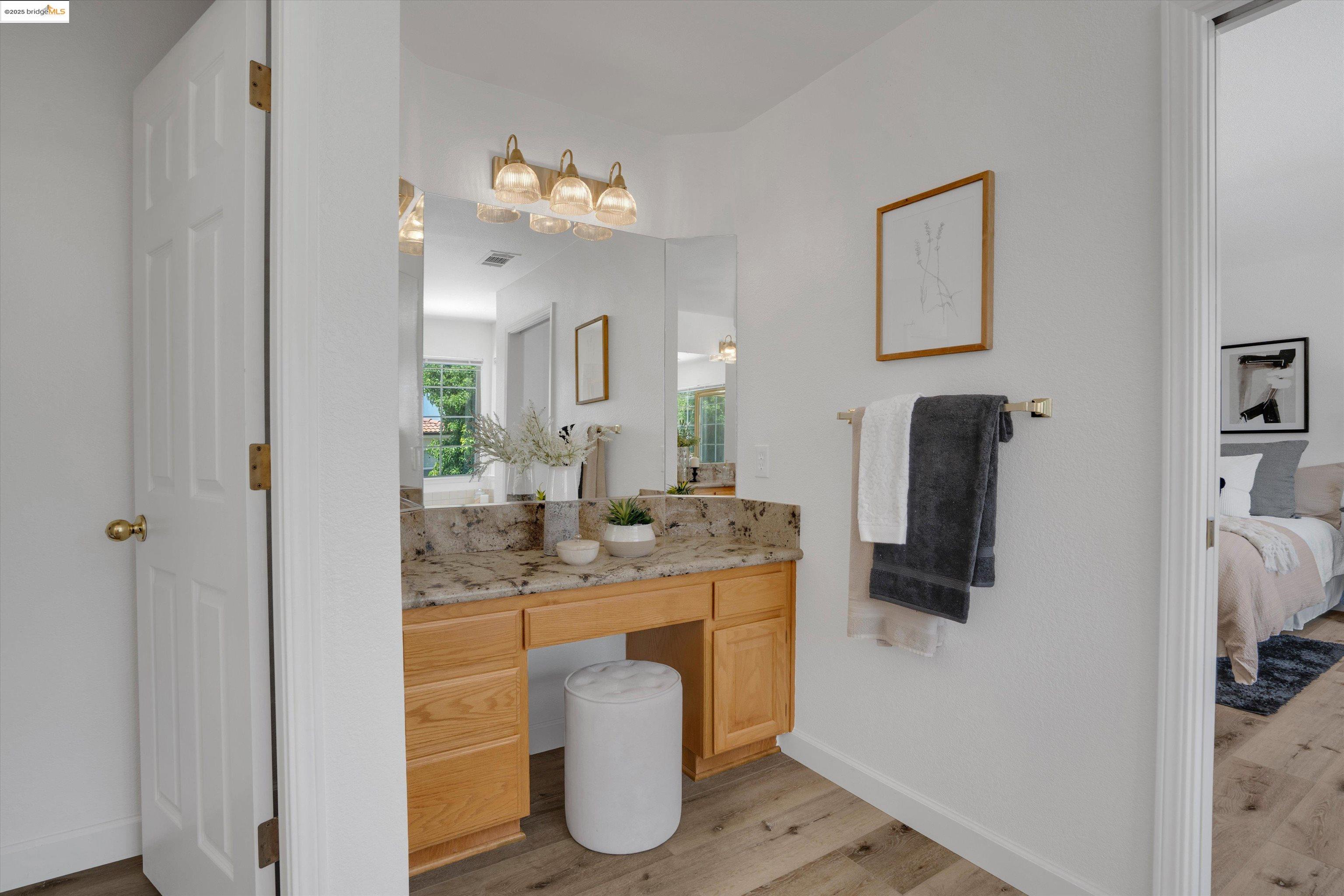805 Devonshire Loop Brentwood, CA 94513 - Photo 28 of 51 a bathroom with a sink and a mirror