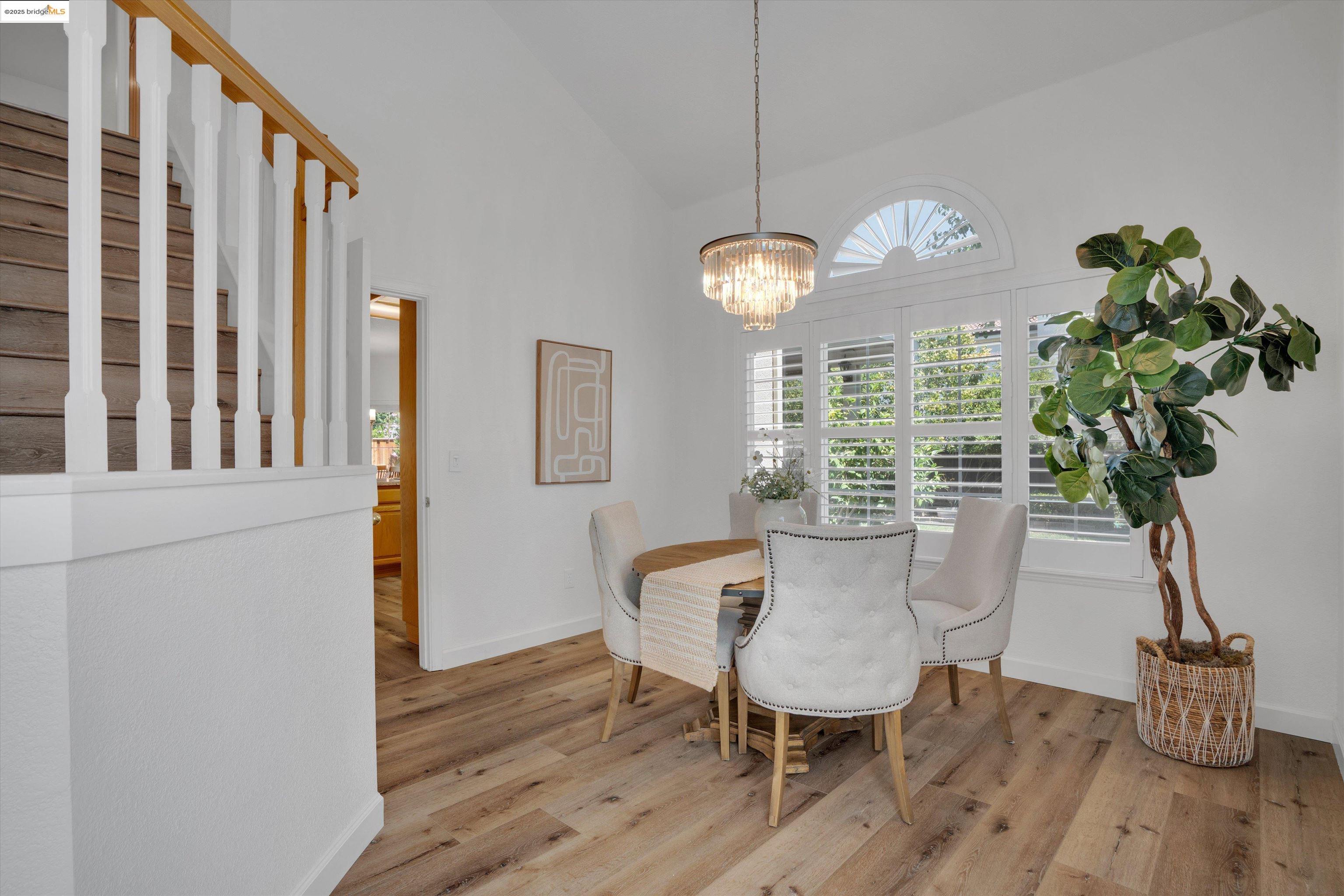 805 Devonshire Loop Brentwood, CA 94513 - Photo 8 of 51 a view of a dining room with furniture window and wooden floor