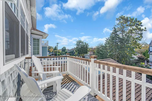 a view of a chair and table on the deck