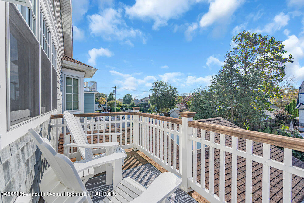 304 Atlantic Avenue Point Pleasant Beach, NJ 08742 - Photo 15 of 20 a view of a chair and table on the deck