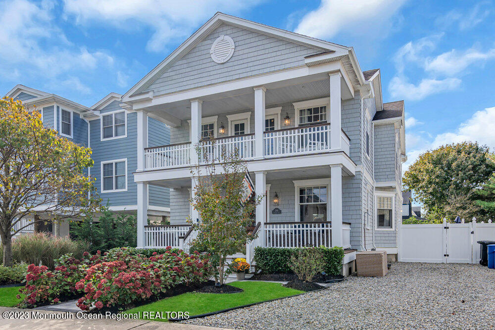 304 Atlantic Avenue Point Pleasant Beach, NJ 08742 - Photo 19 of 20 a front view of a house with garden