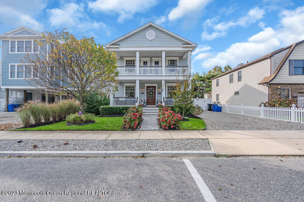 304 Atlantic Avenue Point Pleasant Beach, NJ 08742 - Photo 20 of 20 a front view of a house with a yard and potted plants