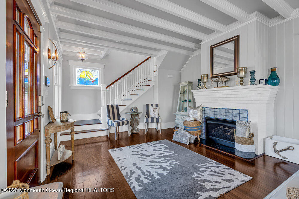 304 Atlantic Avenue Point Pleasant Beach, NJ 08742 - Photo 3 of 20 a living room with furniture and a fireplace
