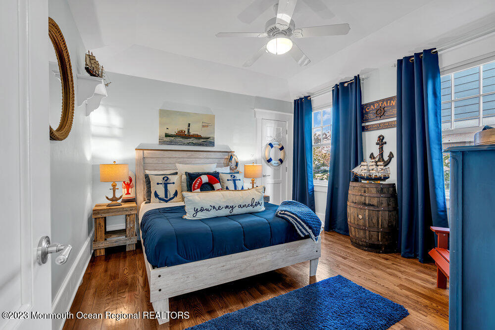 304 Atlantic Avenue Point Pleasant Beach, NJ 08742 - Photo 9 of 20 a bedroom with a bed and wooden floor