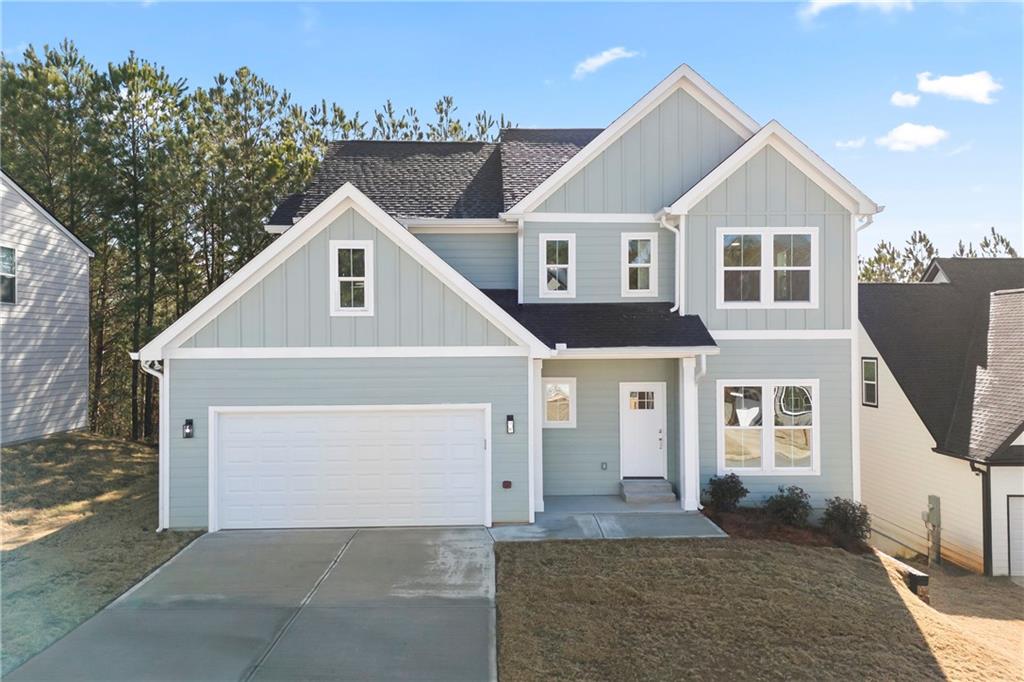 a front view of a house with a garage