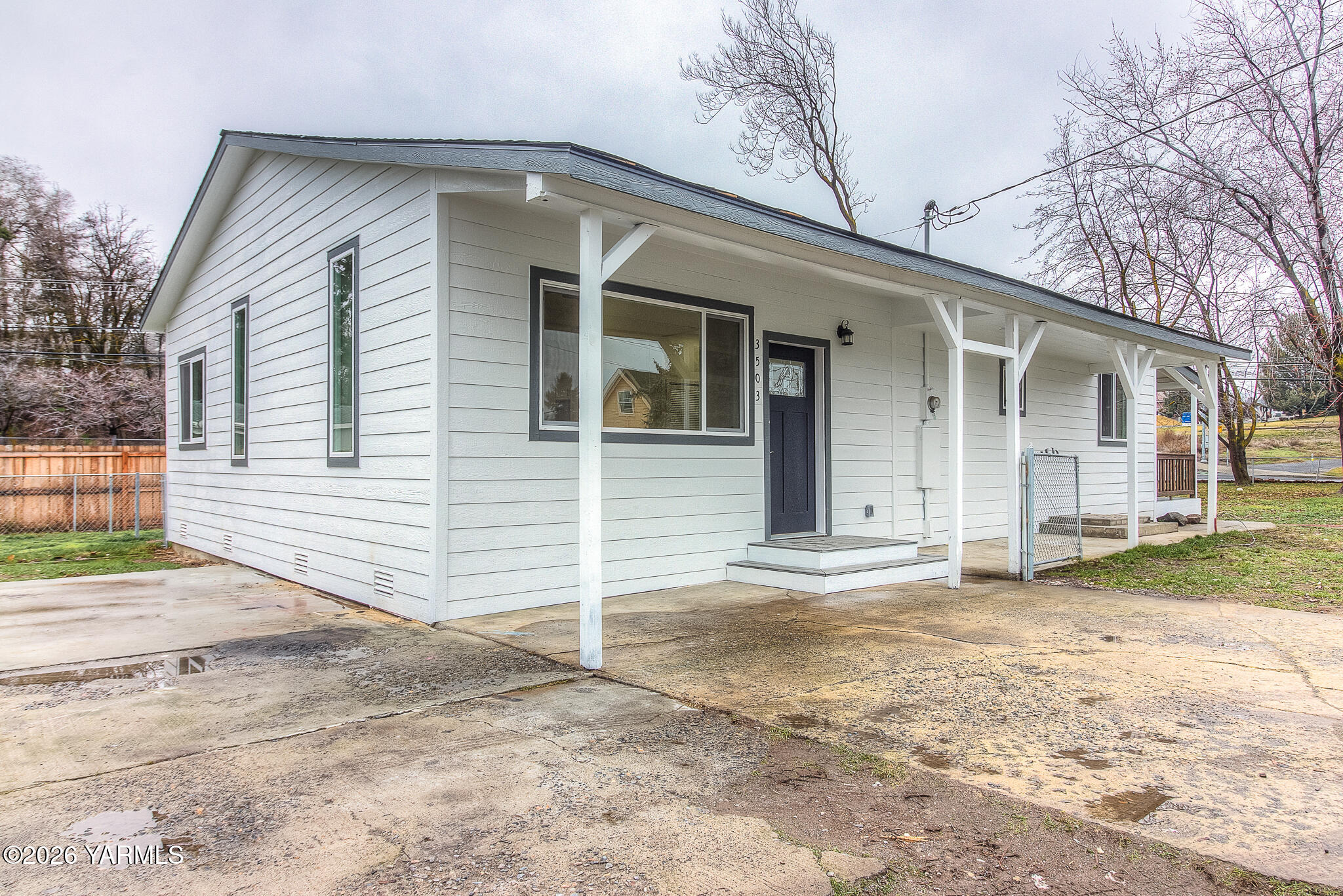 3503 Powerhouse Road Yakima, WA 98902 - Photo 1 of 27 a view of a house with a yard and garage
