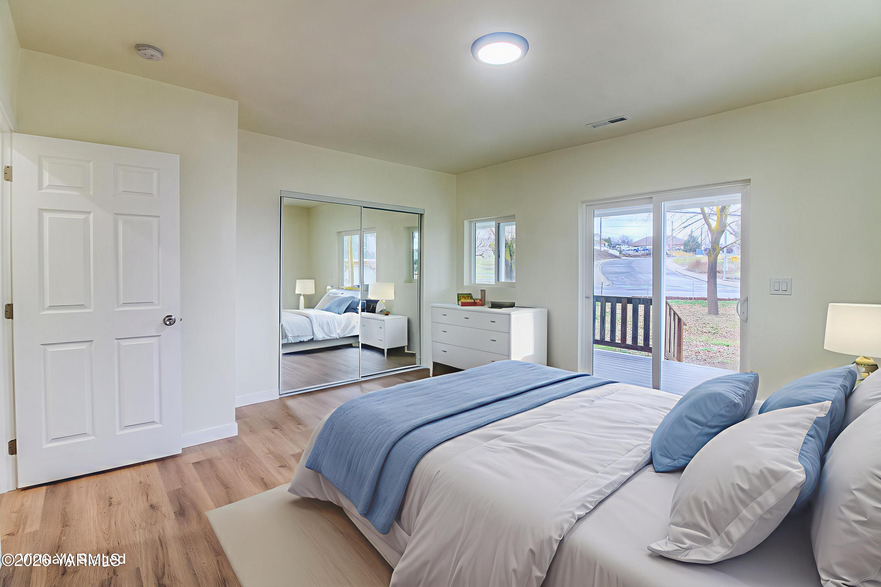 3503 Powerhouse Road Yakima, WA 98902 - Photo 13 of 27 a bedroom with a large bed and a window