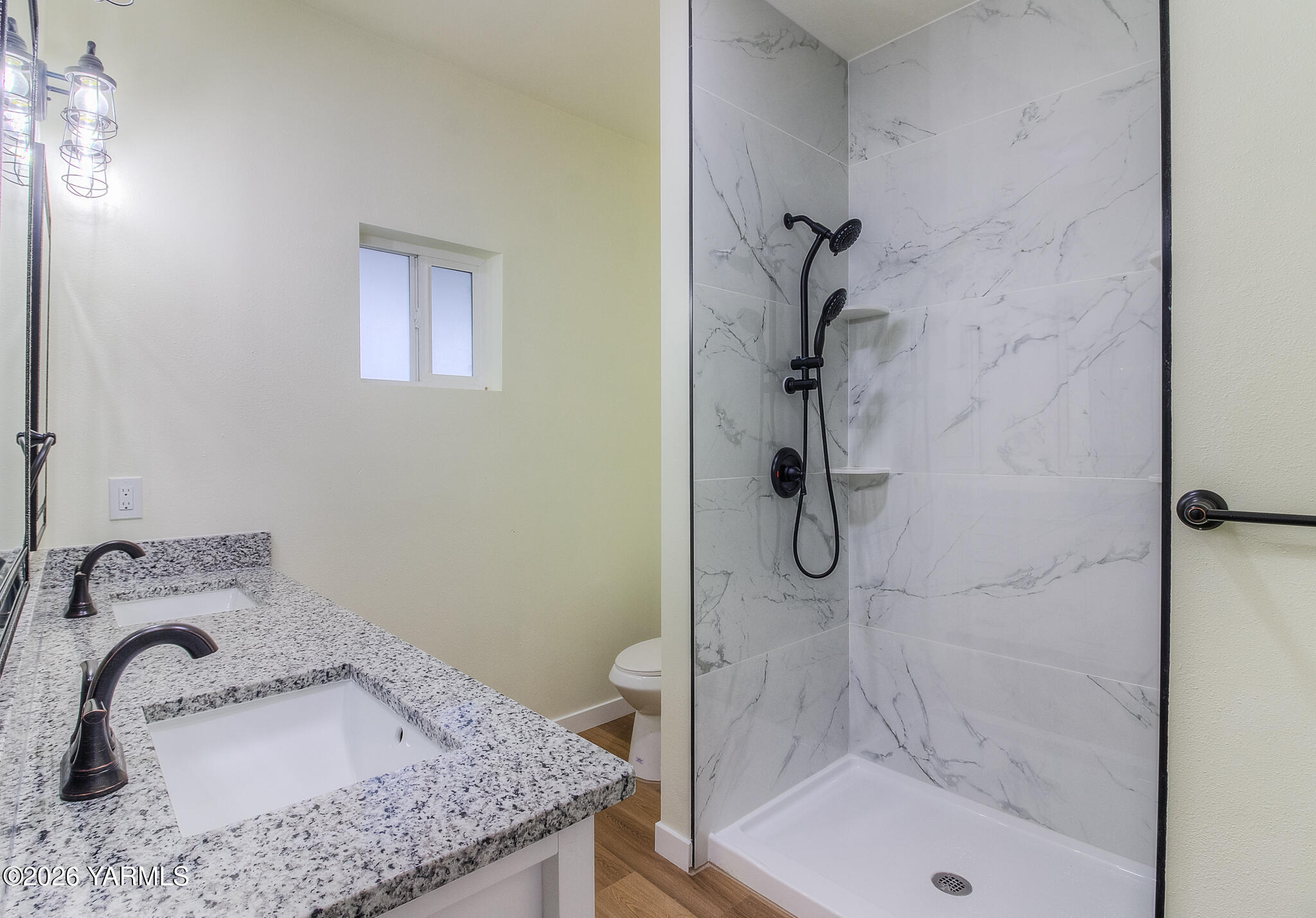 3503 Powerhouse Road Yakima, WA 98902 - Photo 14 of 27 a bathroom with a granite countertop sink a shower and mirror