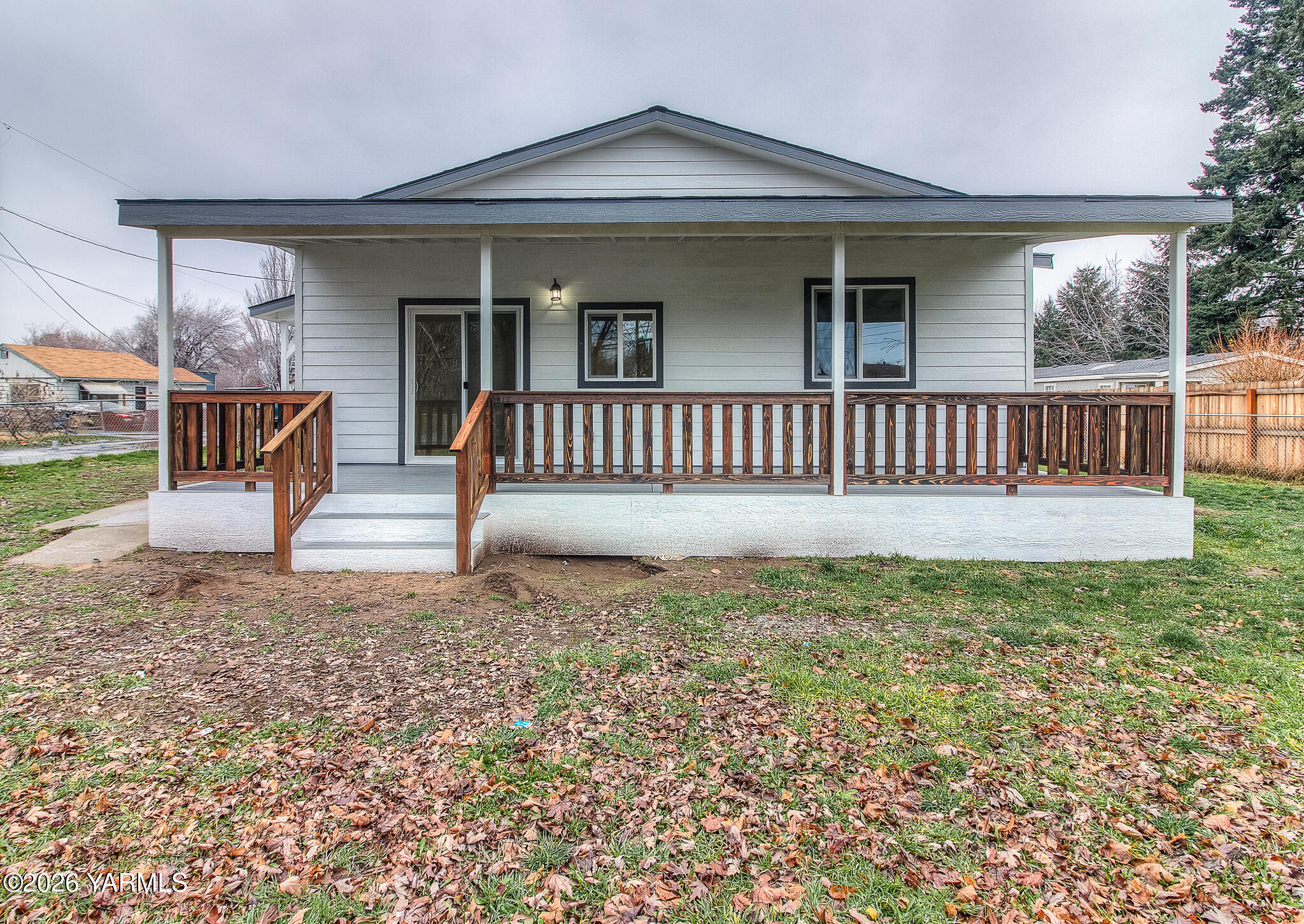 3503 Powerhouse Road Yakima, WA 98902 - Photo 2 of 27 a view of a house with a yard and wooden fence