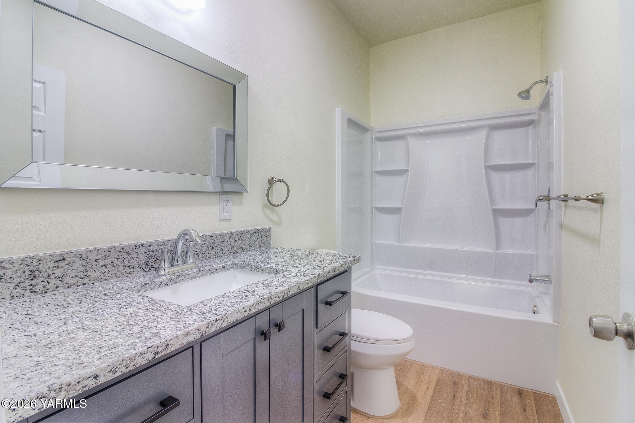 3503 Powerhouse Road Yakima, WA 98902 - Photo 21 of 27 a bathroom with a granite countertop sink toilet and shower