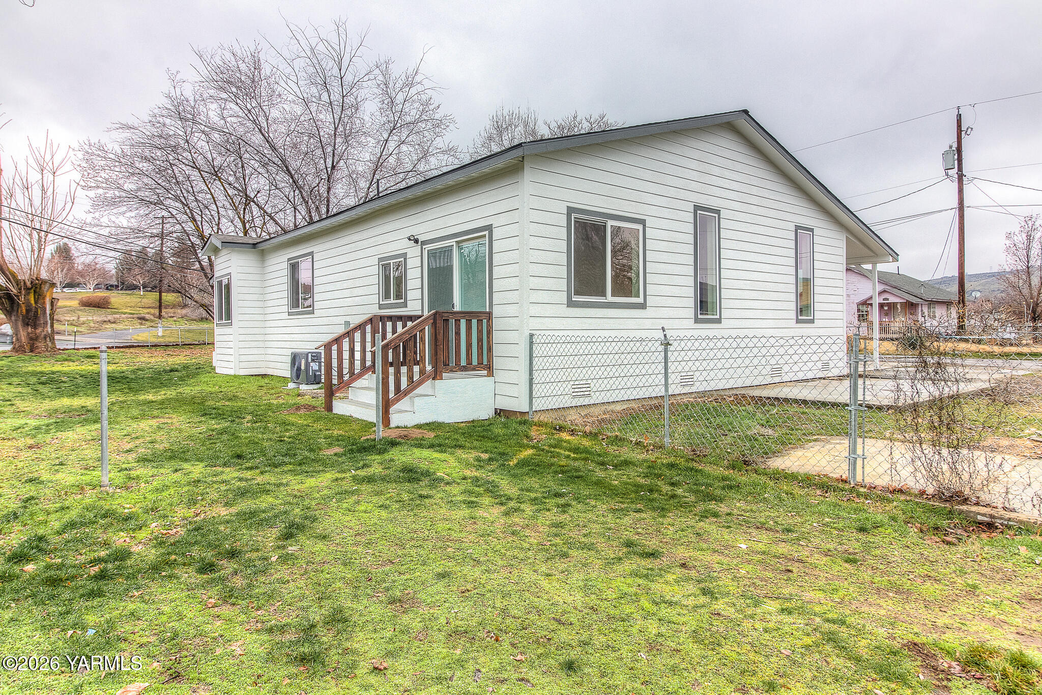 3503 Powerhouse Road Yakima, WA 98902 - Photo 26 of 27 a view of a house with a yard and a patio
