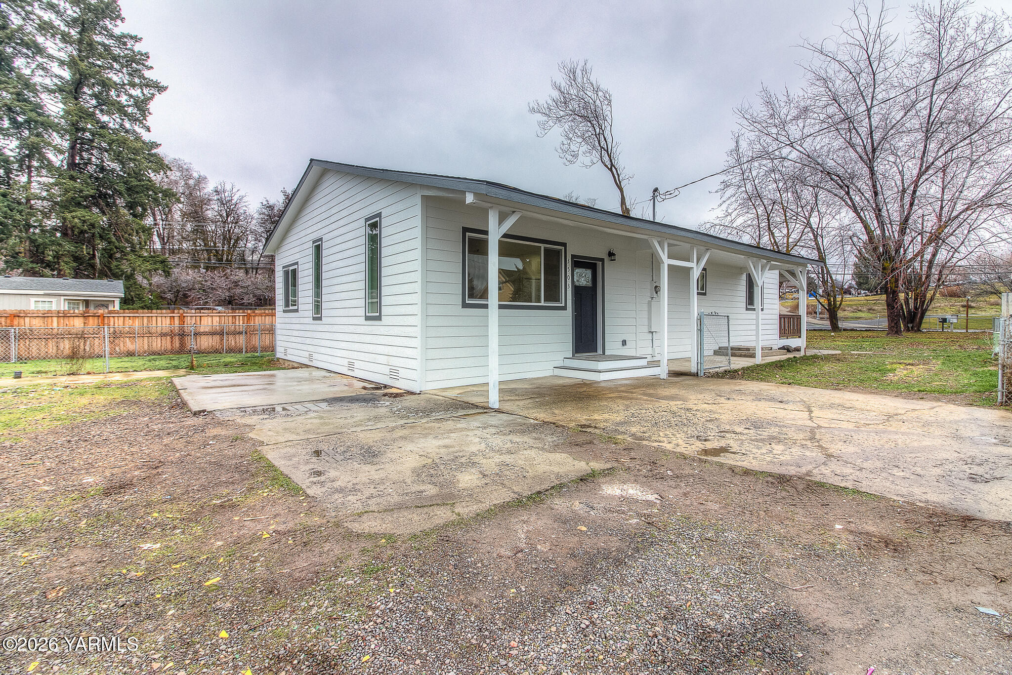 3503 Powerhouse Road Yakima, WA 98902 - Photo 27 of 27 a front view of house with yard and trees around