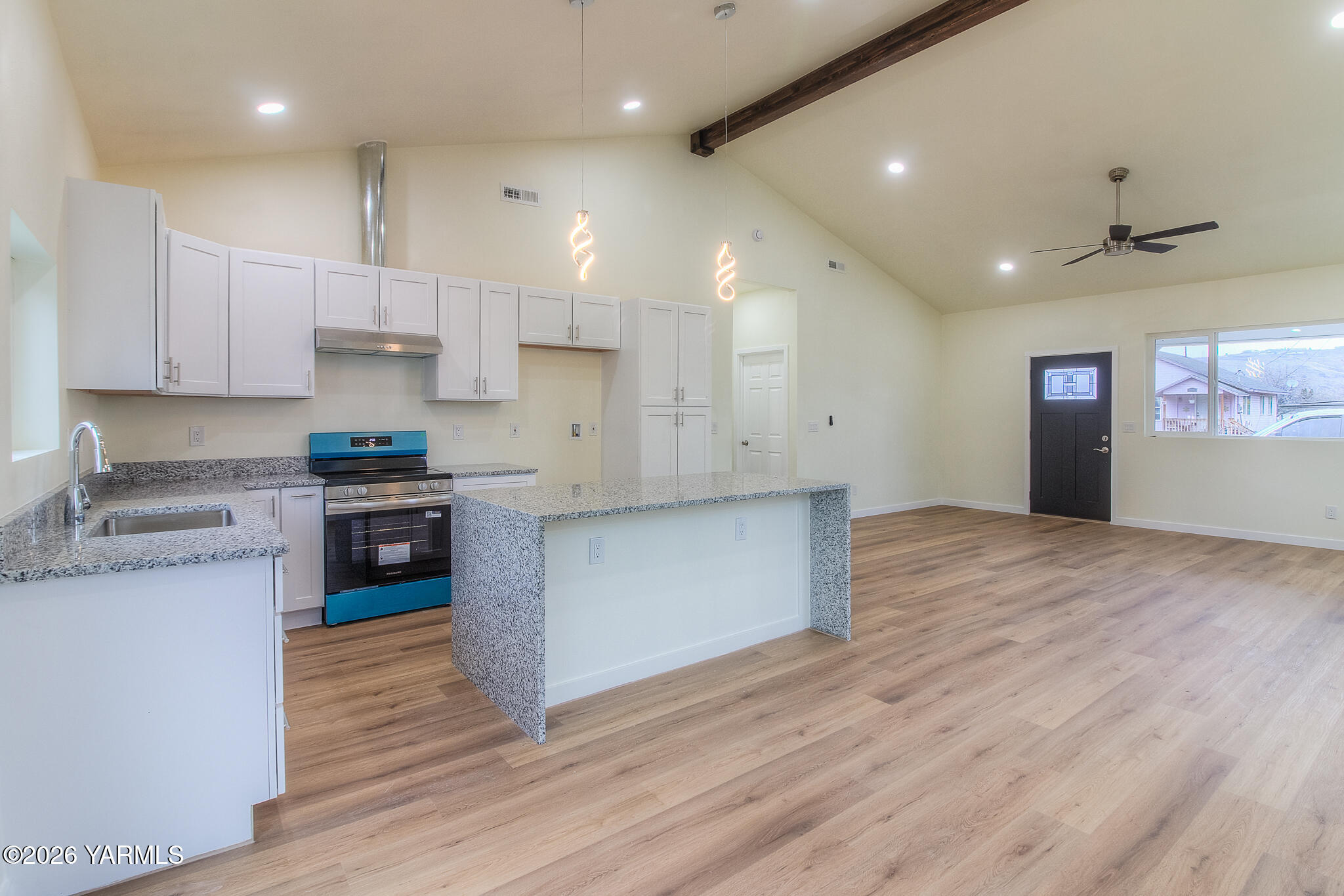 3503 Powerhouse Road Yakima, WA 98902 - Photo 7 of 27 a kitchen with stainless steel appliances granite countertop a stove a sink and a refrigerator
