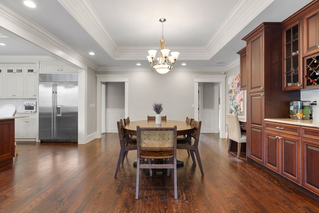 6 Jonas Stone Circle Lexington, MA 02420 - Photo 12 of 42 a view of a dining room with furniture wooden floor and chandelier
