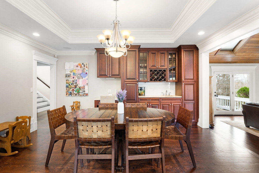 6 Jonas Stone Circle Lexington, MA 02420 - Photo 13 of 42 a view of a dining room with furniture wooden floor and chandelier
