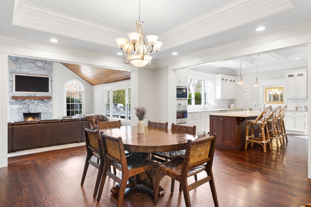 6 Jonas Stone Circle Lexington, MA 02420 - Photo 14 of 42 a view of a dining room with furniture wooden floor and chandelier