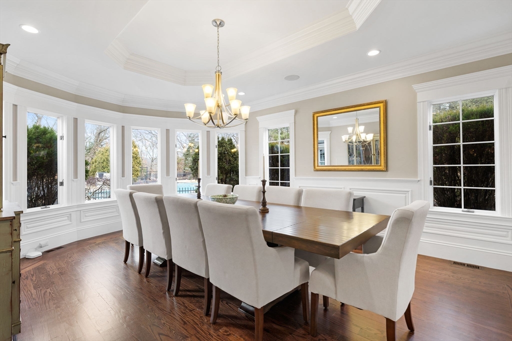 6 Jonas Stone Circle Lexington, MA 02420 - Photo 18 of 42 a view of a dining room with furniture wooden floor and chandelier
