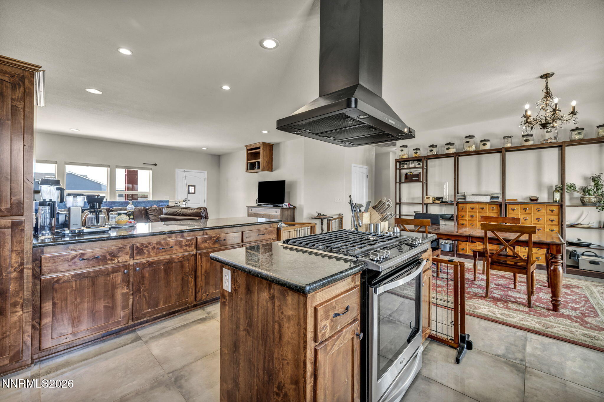 1286 Sky Ridge Drive Fallon, NV 89406 - Photo 9 of 49 a kitchen with stainless steel appliances granite countertop a stove a sink dishwasher and a refrigerator with wooden floor