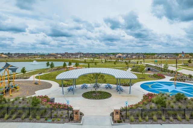 a view of a lake with houses in the back