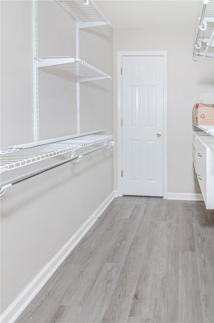 102 Hawk Ridge Drive Anderson, SC 29621 - Photo 15 of 38 This spacious closet features ample shelving and durable flooring, perfect for organized living.