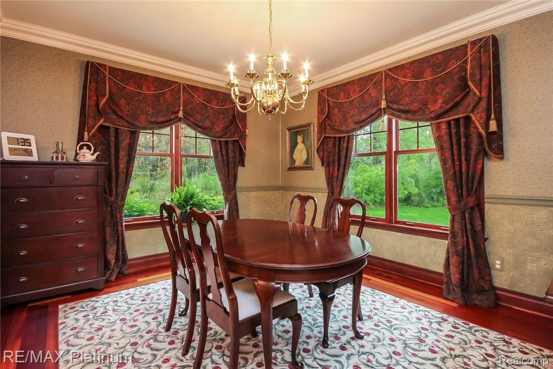 6945 Gawley Road Pinckney, MI 48169 - Photo 15 of 76 Cherry hardwood with carpet inset adds warmth to this room