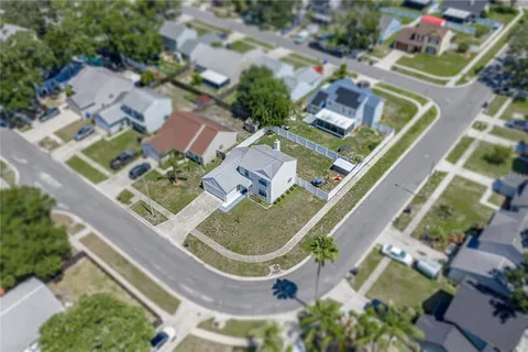 an aerial view of residential house with outdoor space and swimming pool