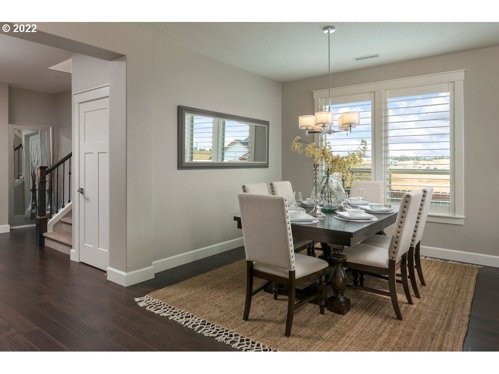 1291 South 44th Avenue Ridgefield, WA 98642 - Photo 4 of 10 a view of a dining room with furniture window and wooden floor