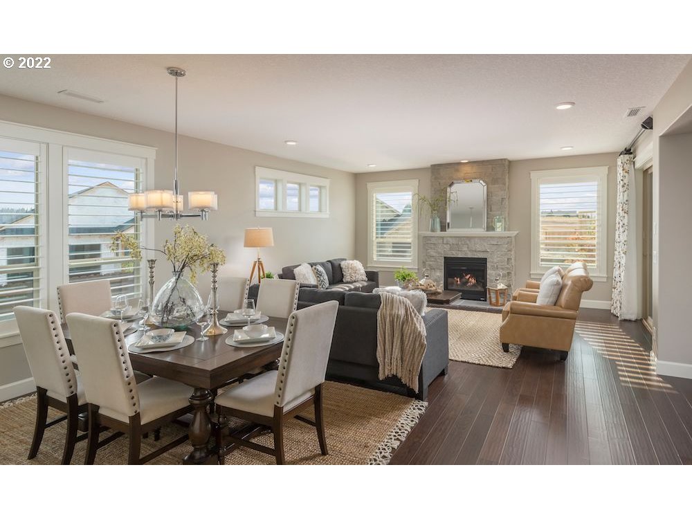 1291 South 44th Avenue Ridgefield, WA 98642 - Photo 6 of 10 a living room with furniture dining table and a fireplace