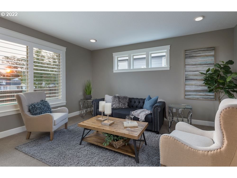 1291 South 44th Avenue Ridgefield, WA 98642 - Photo 7 of 10 a living room with furniture and a potted plant