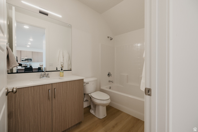 2759 Becco Trail, Unit 16 St. George, UT 84770 - Photo 25 of 42 Full bathroom with vanity, tub / shower combination, light wood-style floors, and vaulted ceiling