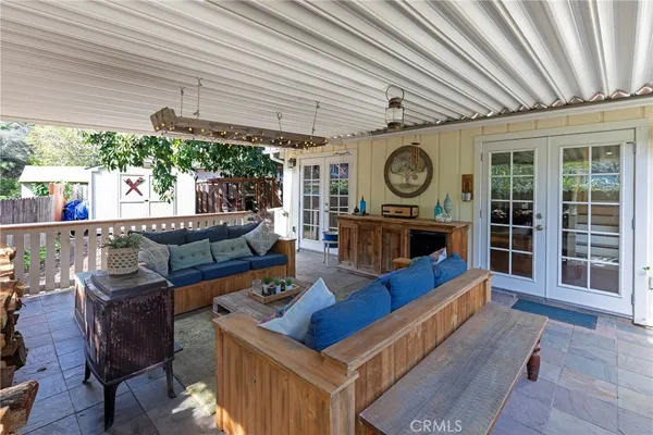 a view of a living room with furniture and a grill