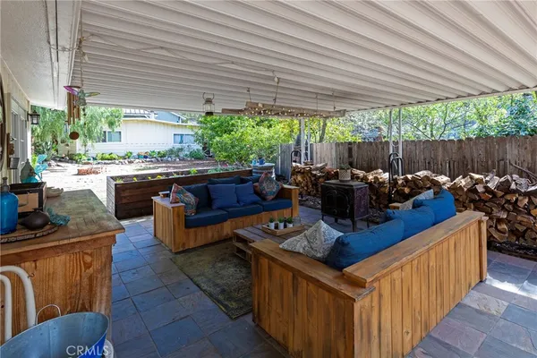 a view of a backyard with sitting area and furniture